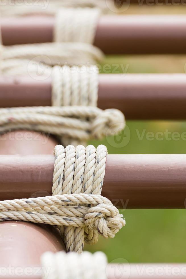 Rope knot around metal pipe photo