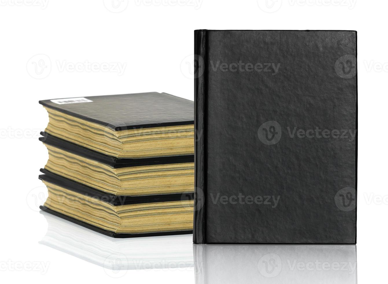 Black book is laying with shadow on white background photo