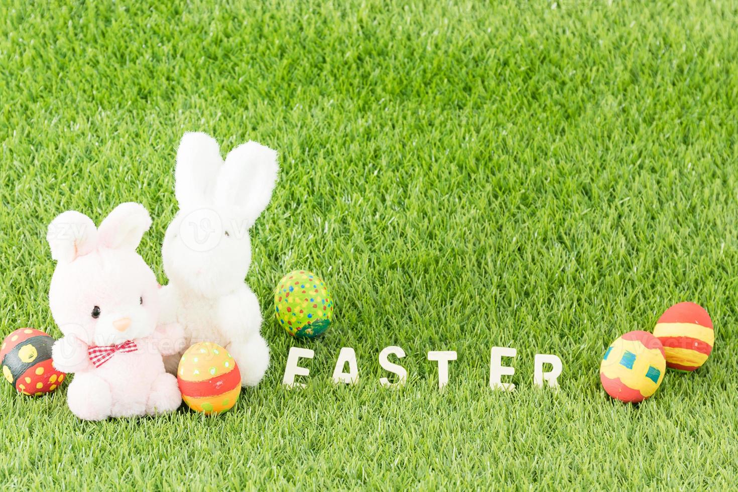 Bunny toy and Easter eggs with text photo