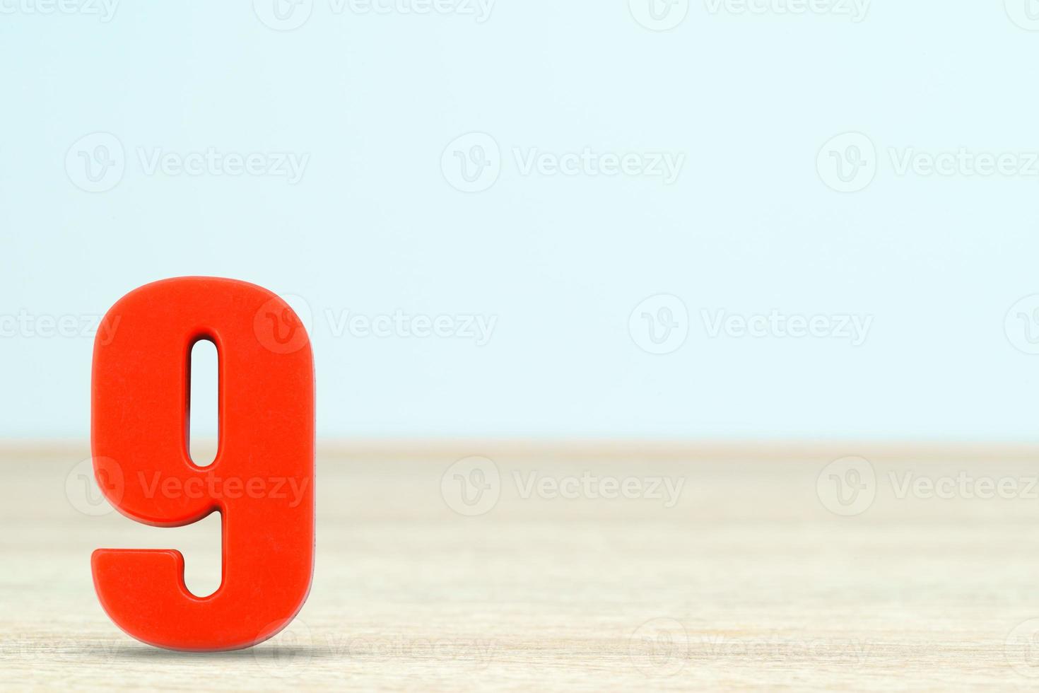 Shot of a number nine made of red plastic photo