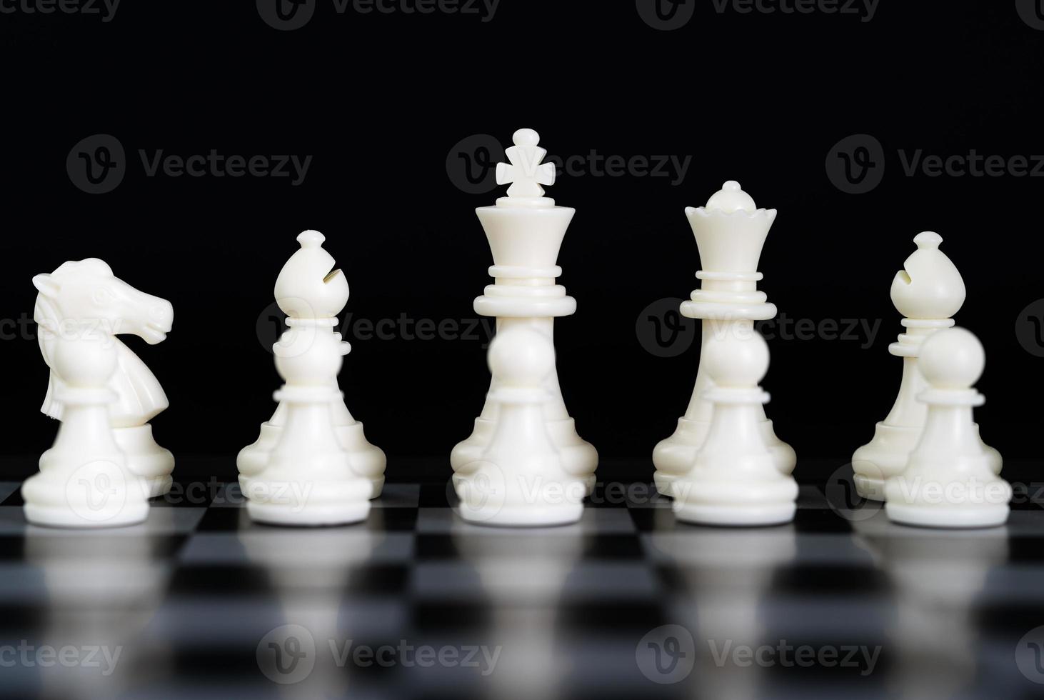 Chess pieces on chessboard photo