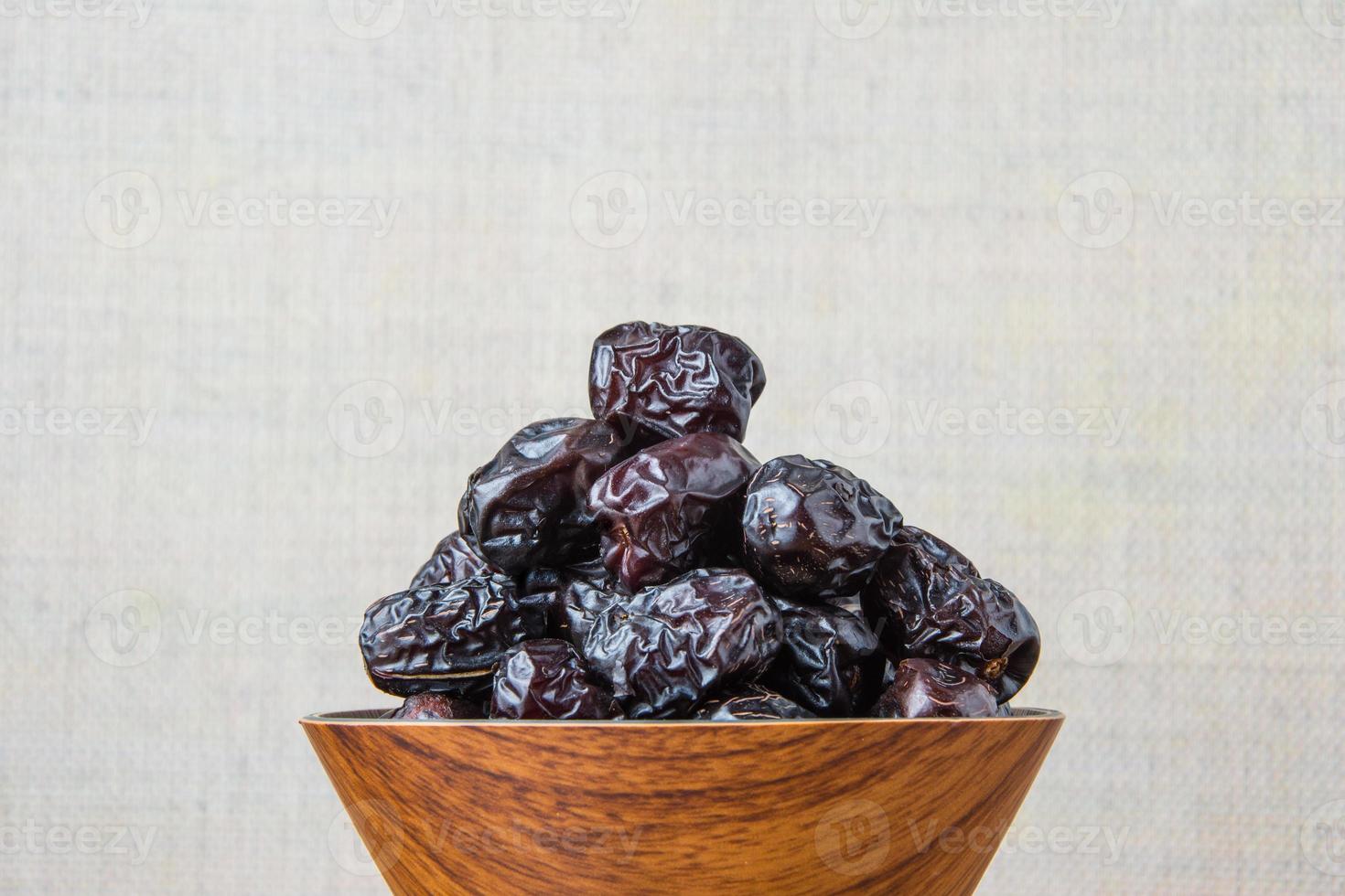 Delicious ajwa dates kurma nabi, Much sought after during the month of Ramadan as a dish for breaking the fast, ramadhan kareem, empty space, copy space. photo