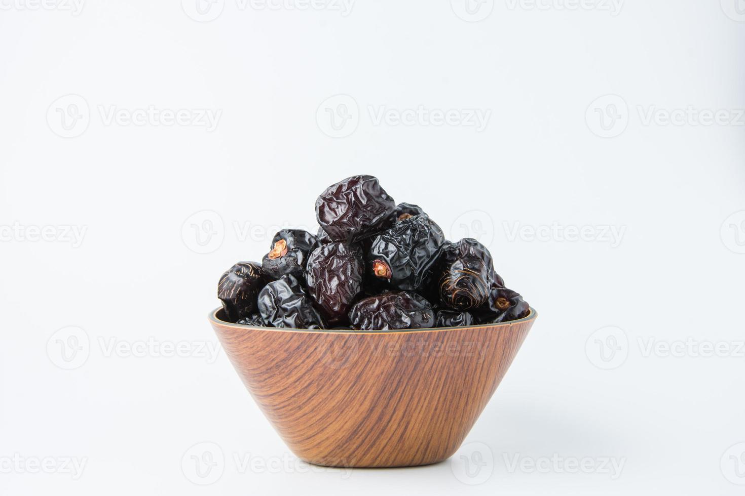 Delicious ajwa dates kurma nabi, Much sought after during the month of Ramadan as a dish for breaking the fast, ramadhan kareem, empty space, copy space. photo