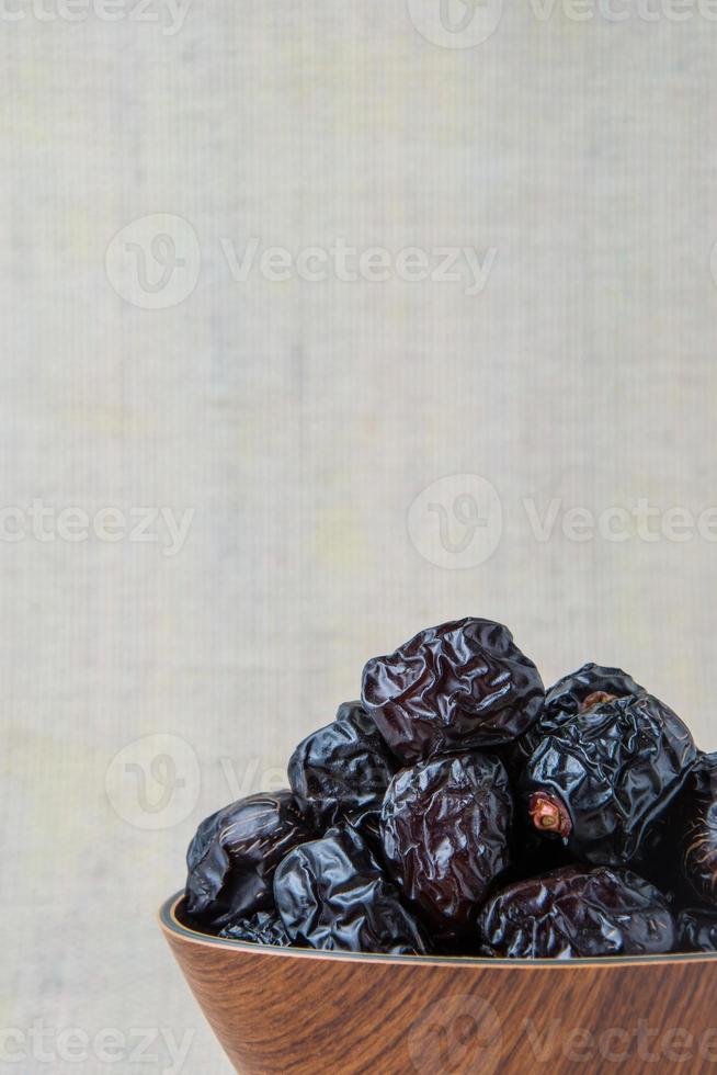 Delicious ajwa dates kurma nabi , Much sought after during the month of Ramadan as a dish for breaking the fast, ramadhan kareem, empty space, copy space. photo