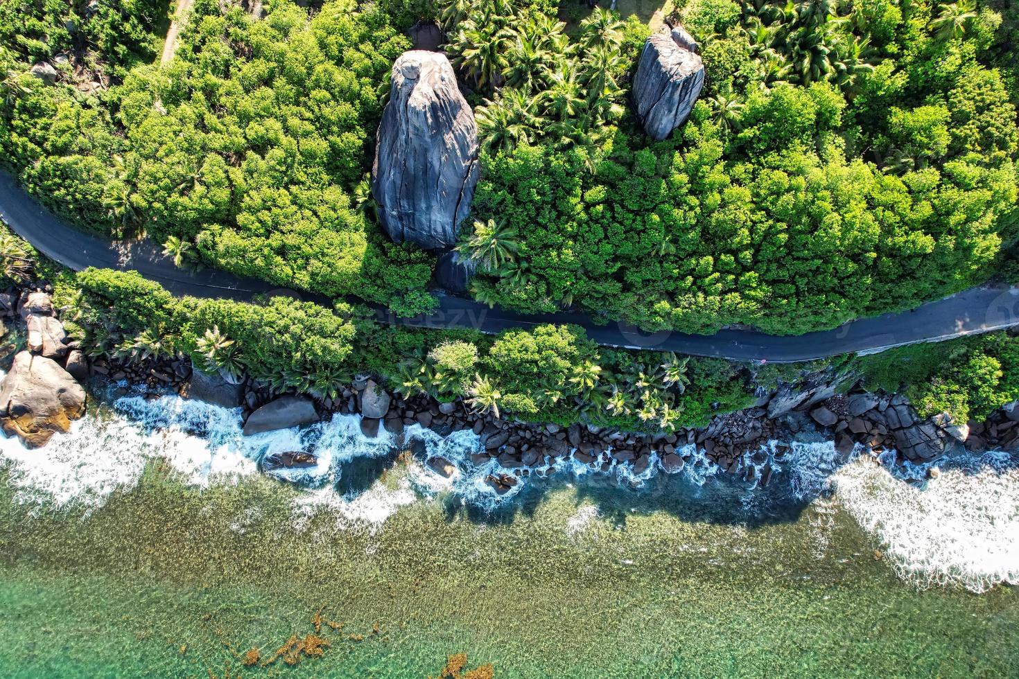 Beautiful road the the cliff, huge granite rocks, lush vegetation photo