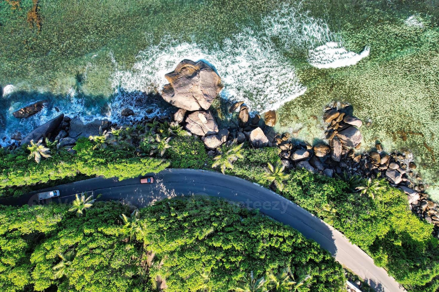 Drone bird eye view of Beautiful road the the cliff, huge granite rocks, lush vegetation photo