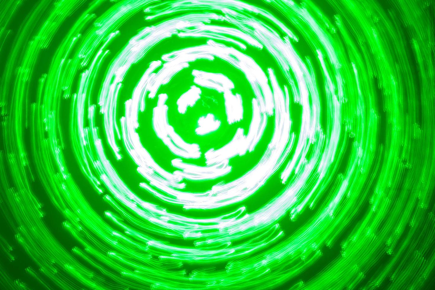 abstract background of green light circles made with lightpainting technique photo