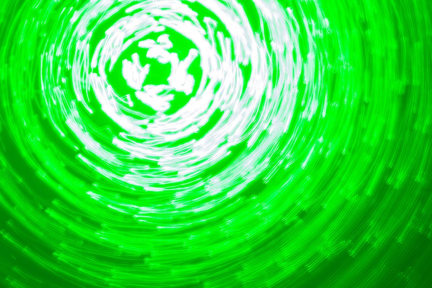 abstract background of green light circles made with lightpainting technique photo