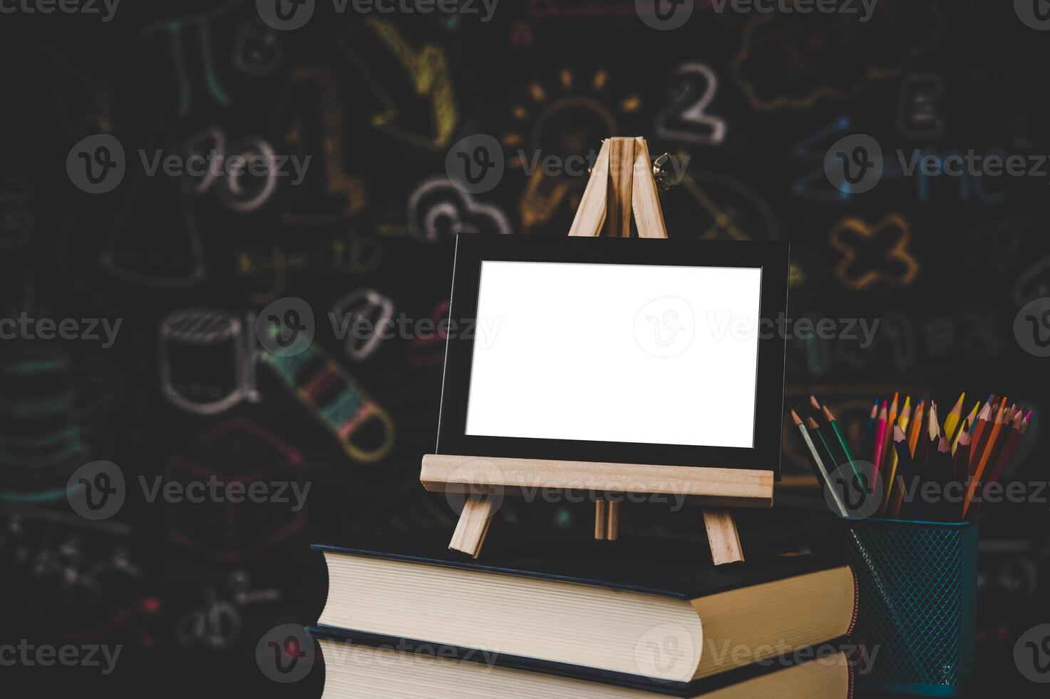 black photo frame on the stand on the books in classroom