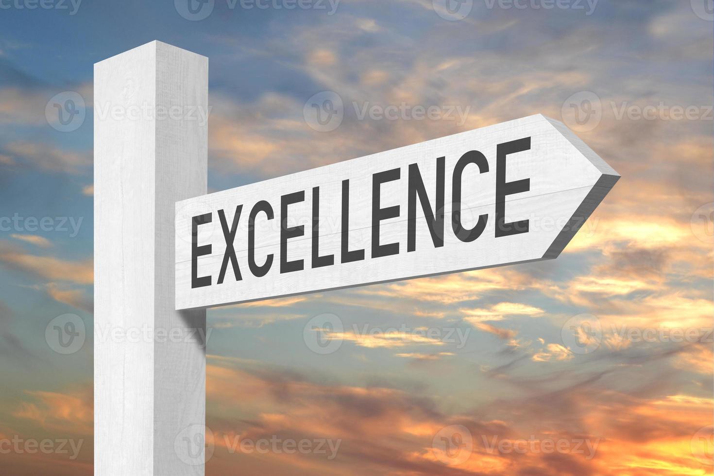 Excellence - White Wooden Signpost with one Arrow and Sunset Sky in Background photo