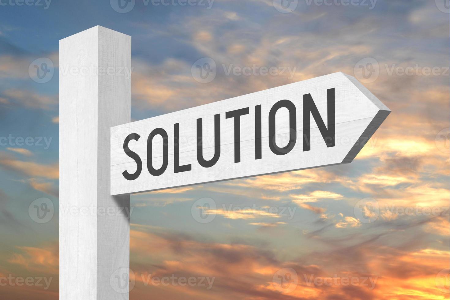 Solution - White Wooden Signpost with one Arrow and Sunset Sky in Background photo