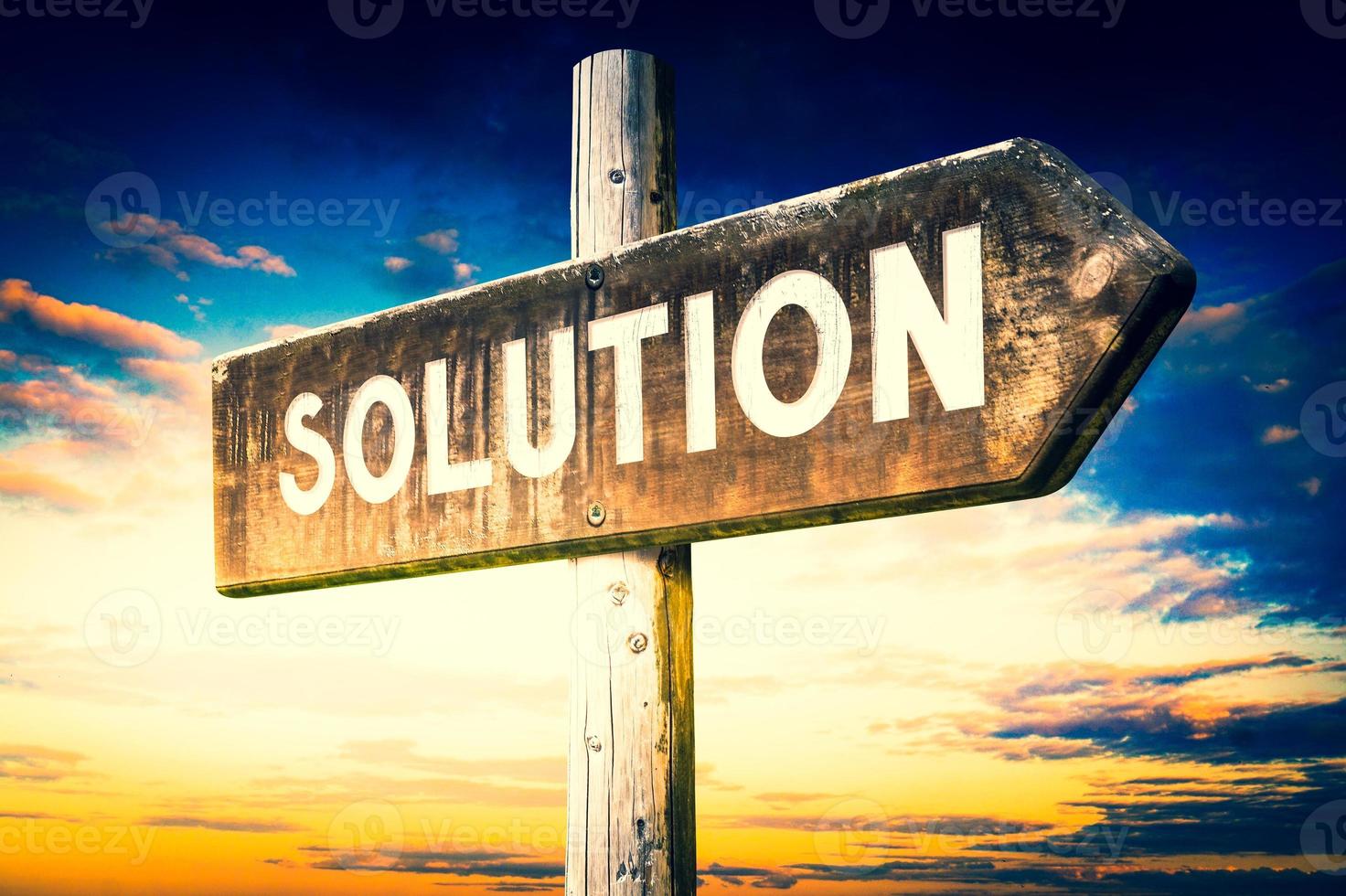 Solution - Wooden Signpost with one Arrow, Sunset Sky in Background photo