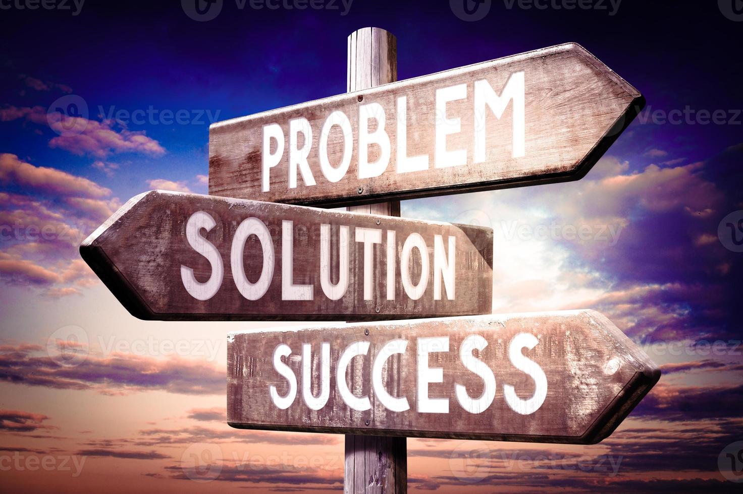 Problem, Solution, Success - Wooden Signpost with Three Arrows, Sunset Sky in Background photo