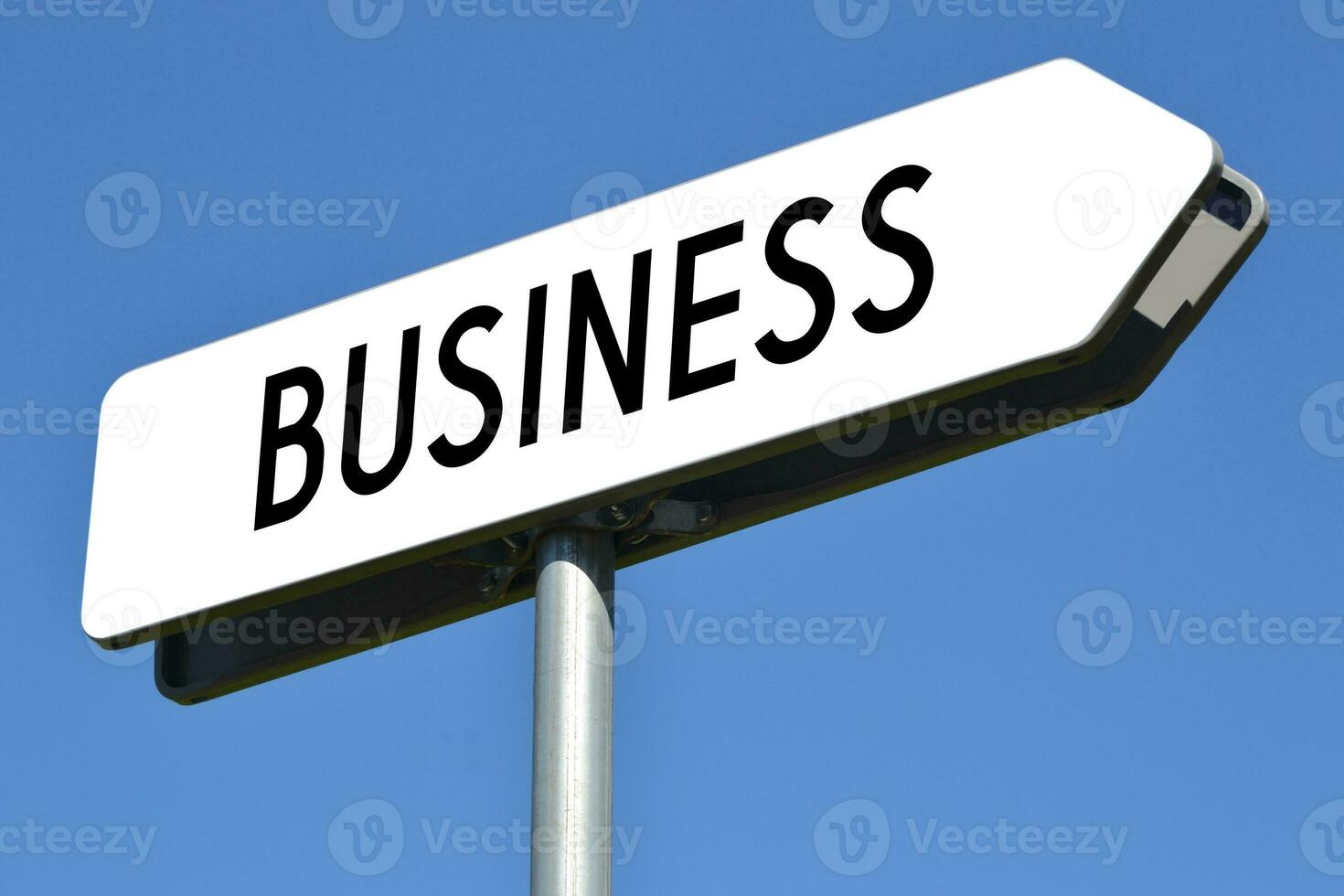 Business - White, Metal Signpost and Sky in Background photo