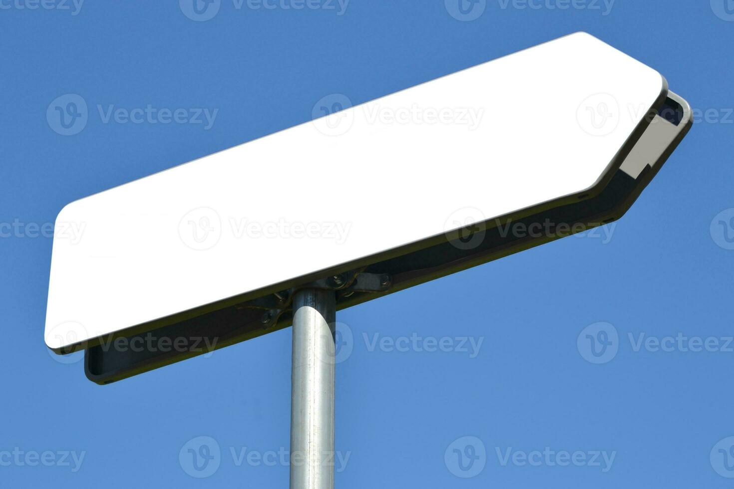 Empty White, Metal Signpost and Sky in Background photo