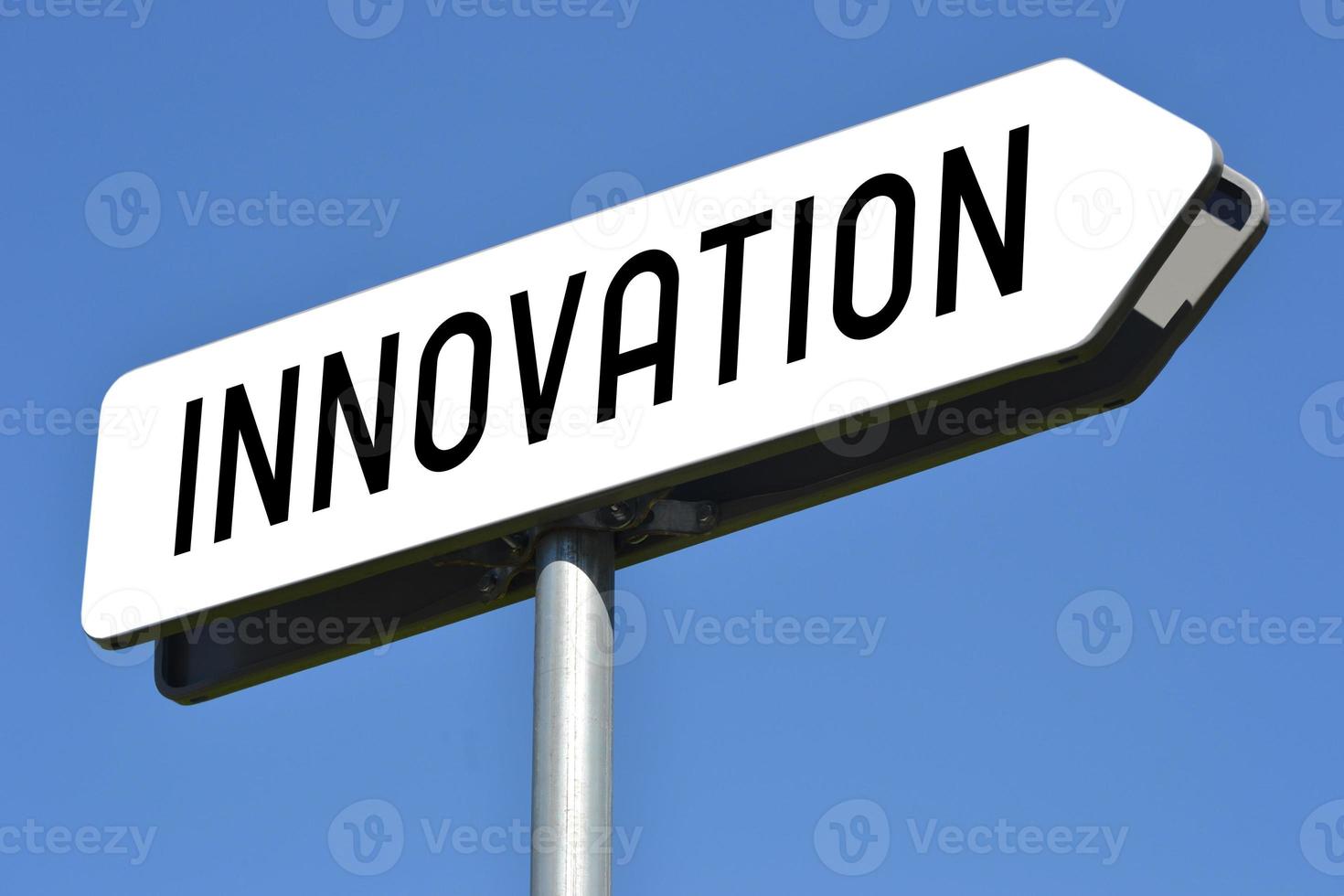 Innovation - White, Metal Signpost and Sky in Background photo