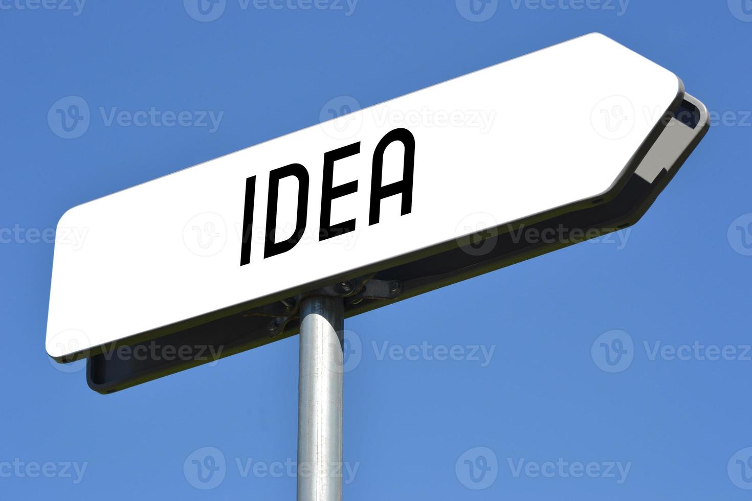Idea - White, Metal Signpost and Sky in Background photo