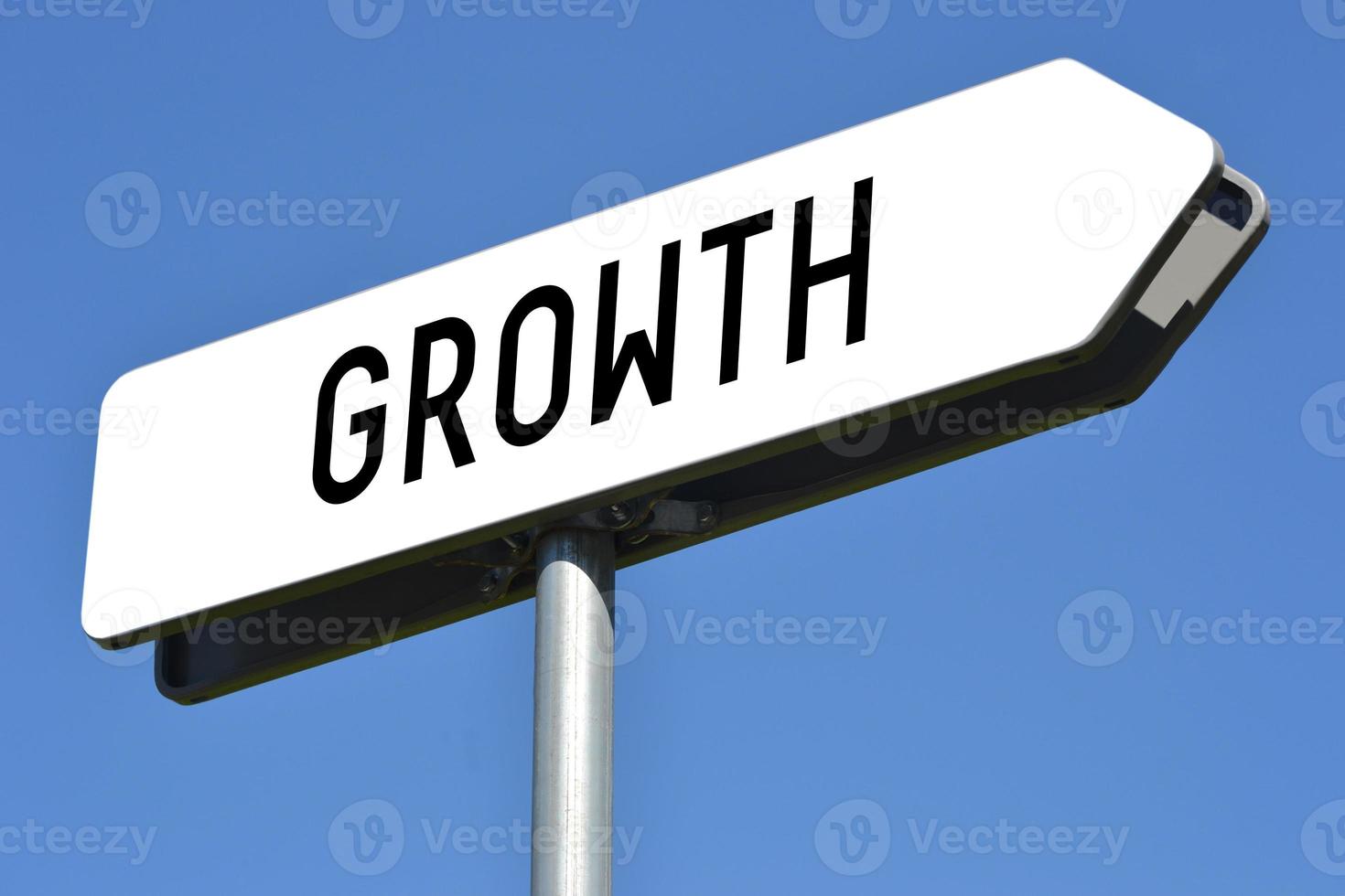 Growth - White, Metal Signpost and Sky in Background photo
