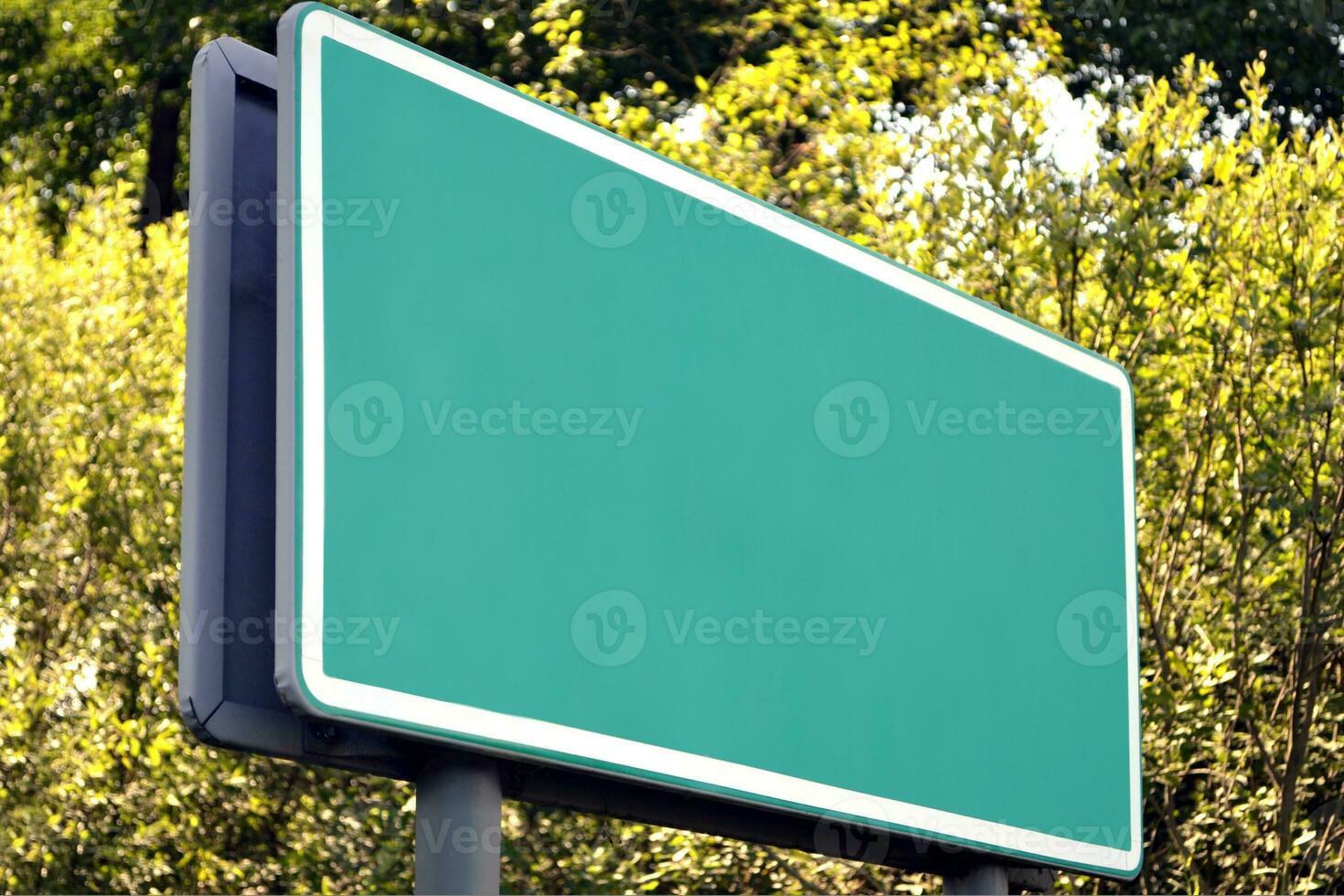 Clear Green Road Sign on a Highway photo