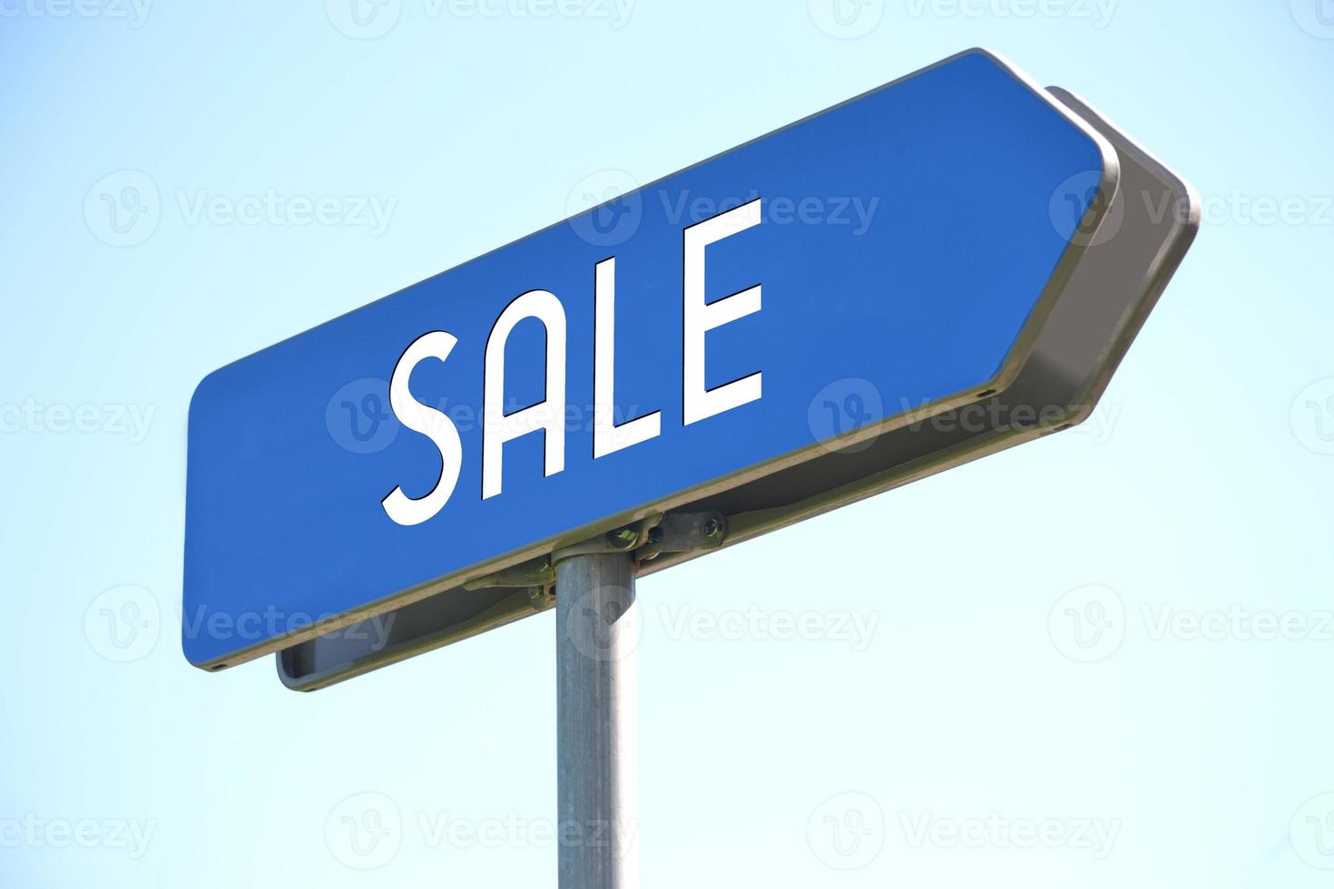 Sale - Blue Metal Signpost and Sky in Background photo