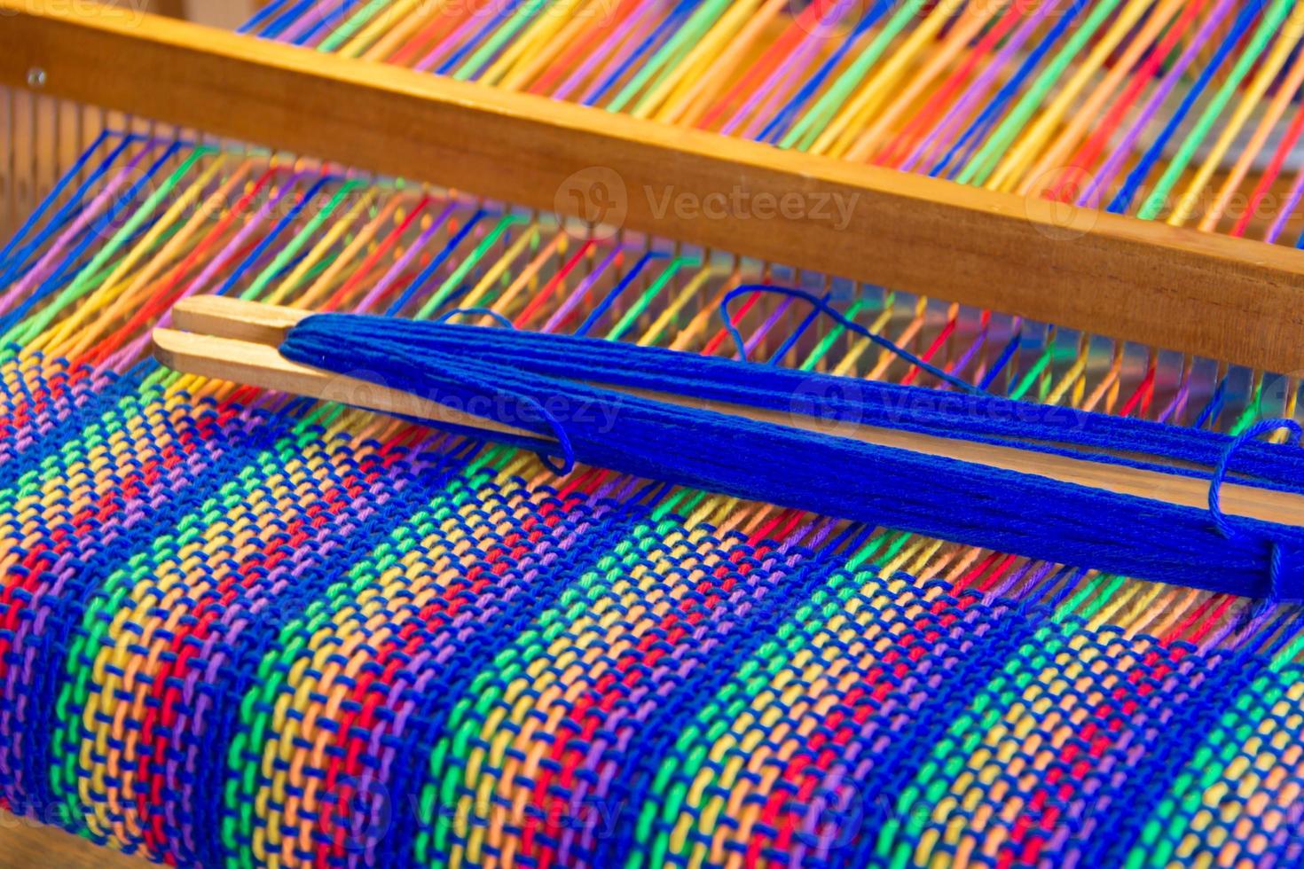 Comb loom with rainbow colors and diversity flag photo