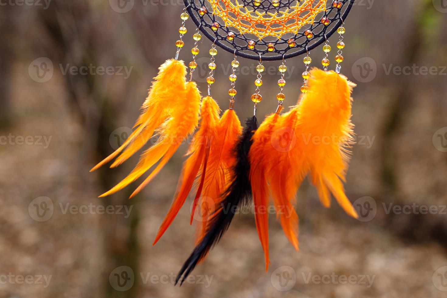 Handmade dream catcher with feathers threads and beads rope hanging photo