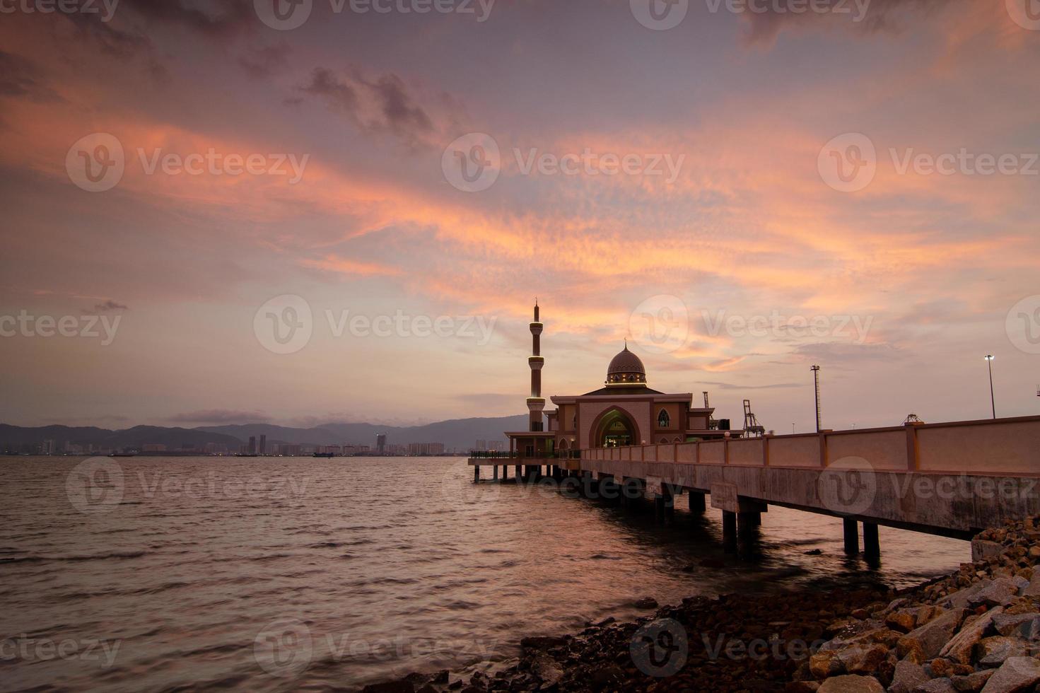 Amazing sunset over architecture Mosque at Penang Port photo