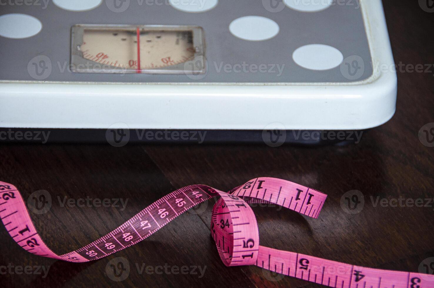 Close-up of weight scale measure tap and scale machine. Weight loss Concept. photo