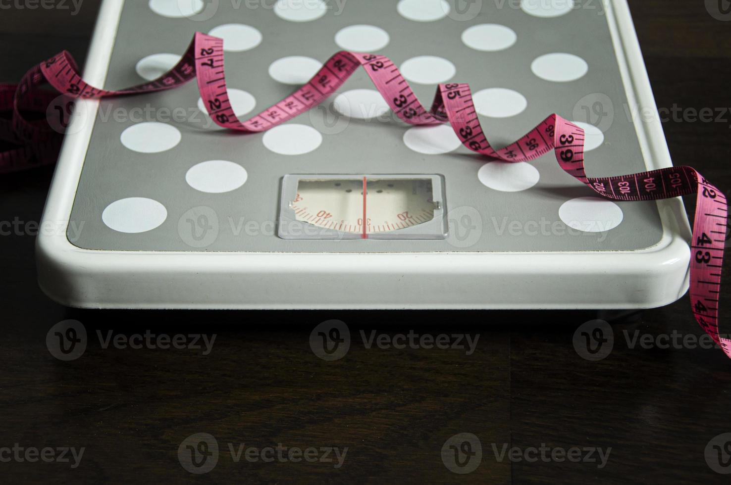 Straight view of weight scale and measuring tape. Weight loss concept. photo