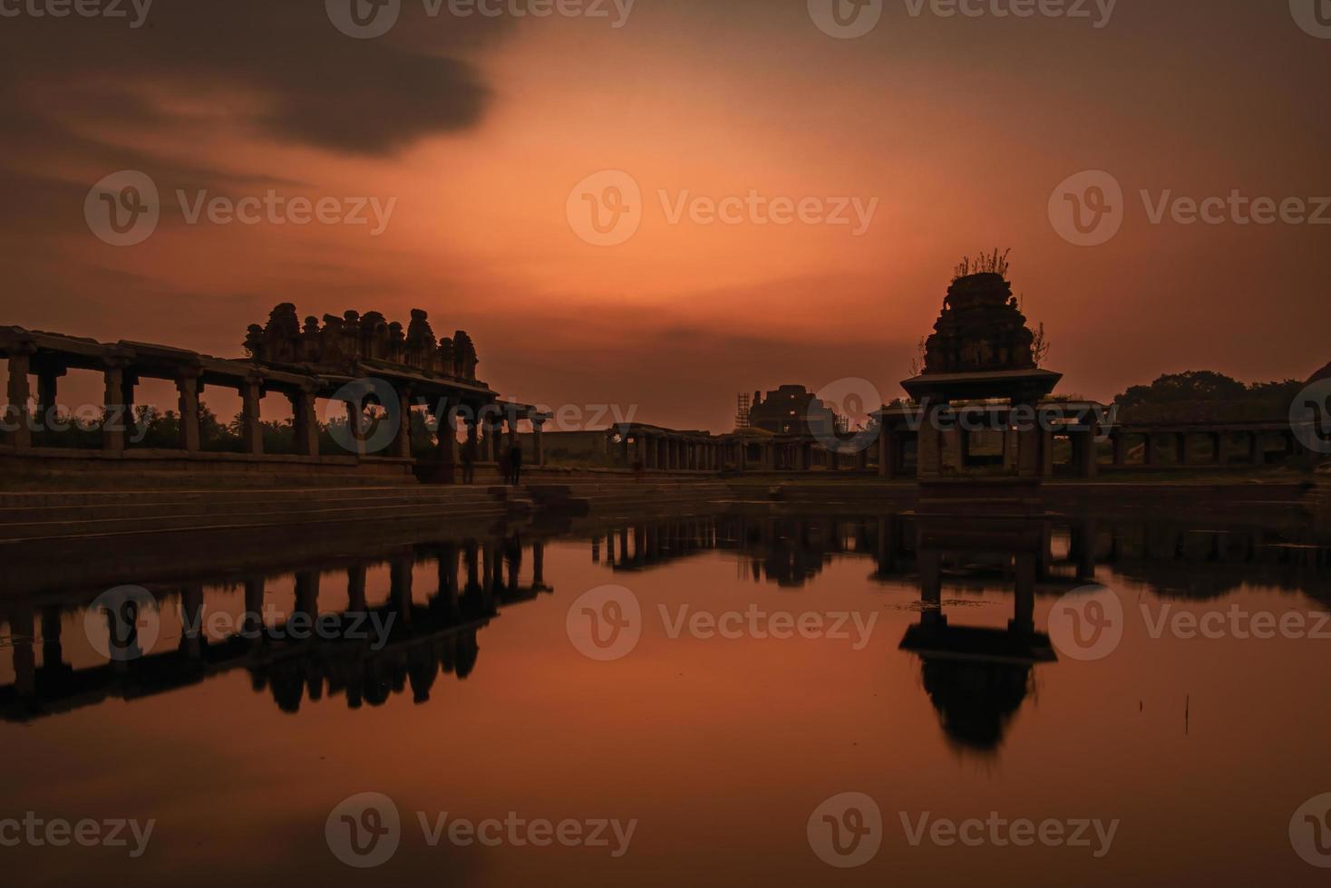 Sunset at Pushkarani lake near Vijaya Vitthala temple in Hampi photo