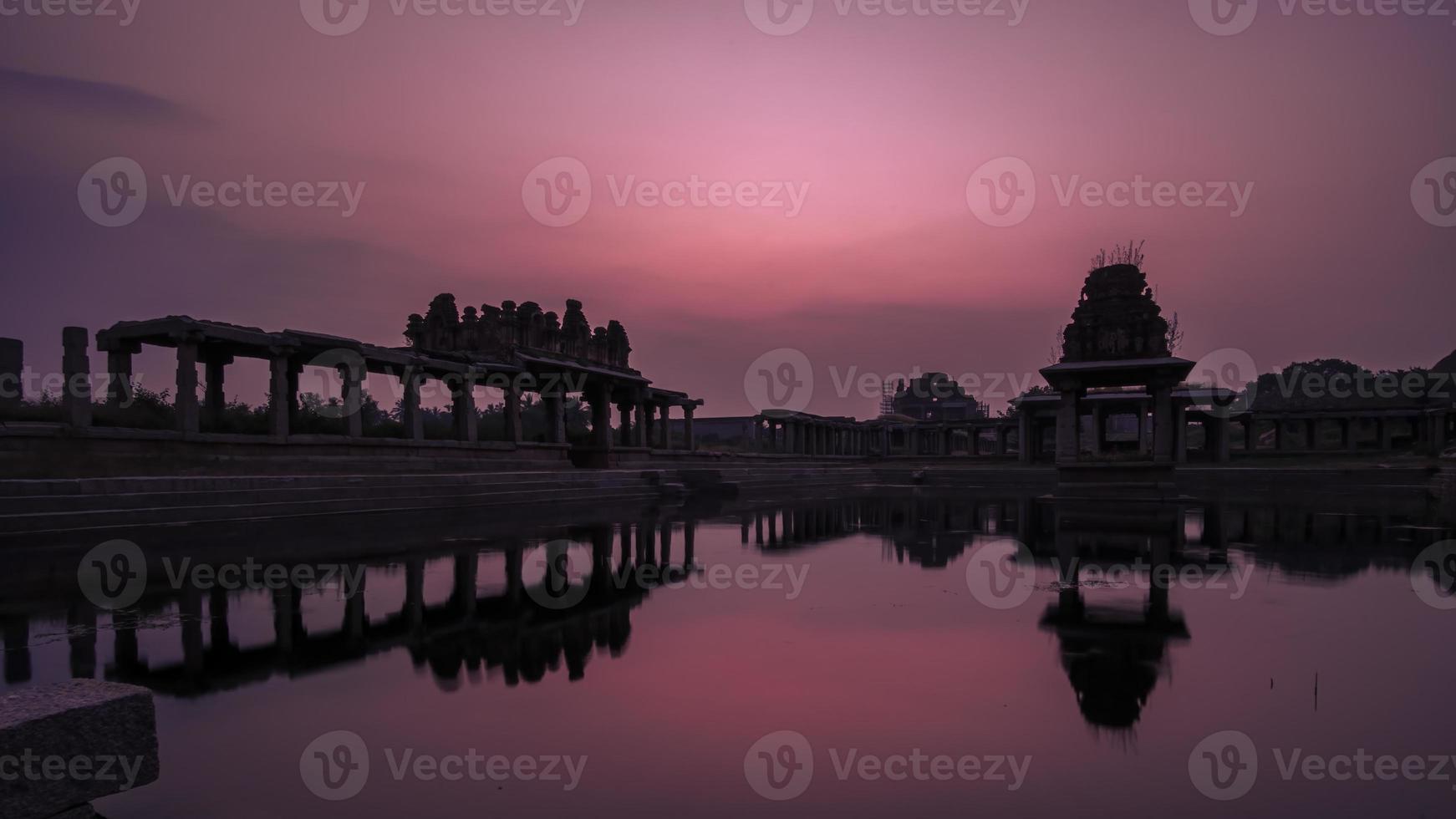 Sunset at Pushkarani lake near Vijaya Vitthala temple in Hampi photo