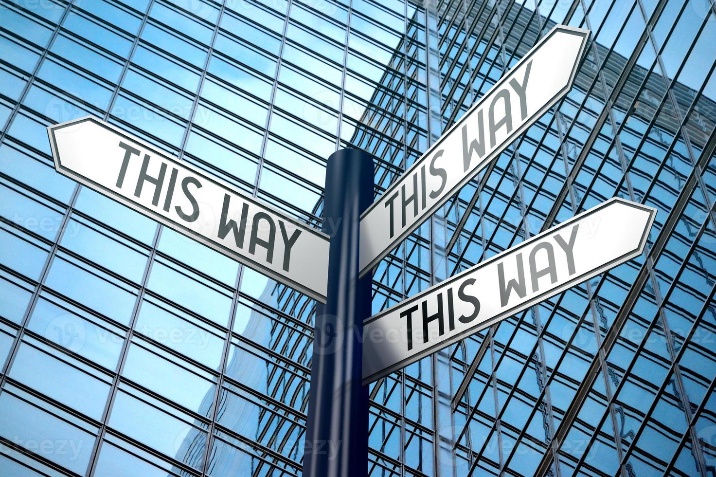 This Way Concept - Signpost With Three Arrows, Office Building in Background photo