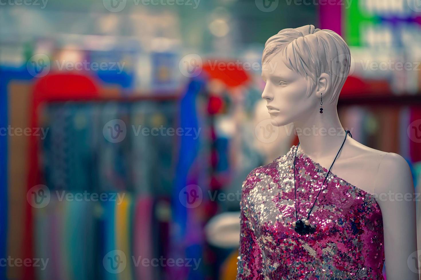 Female mannequin in a fabric store. White plastic woman. photo