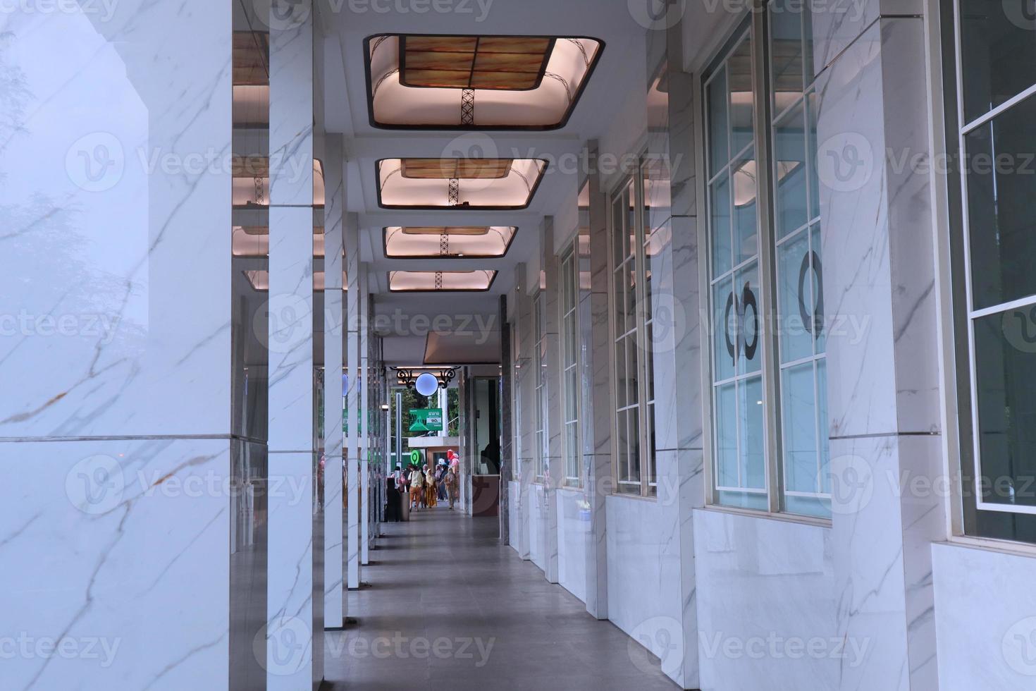 Corridor in mall terrace with luxury ceiling and marble pillars photo