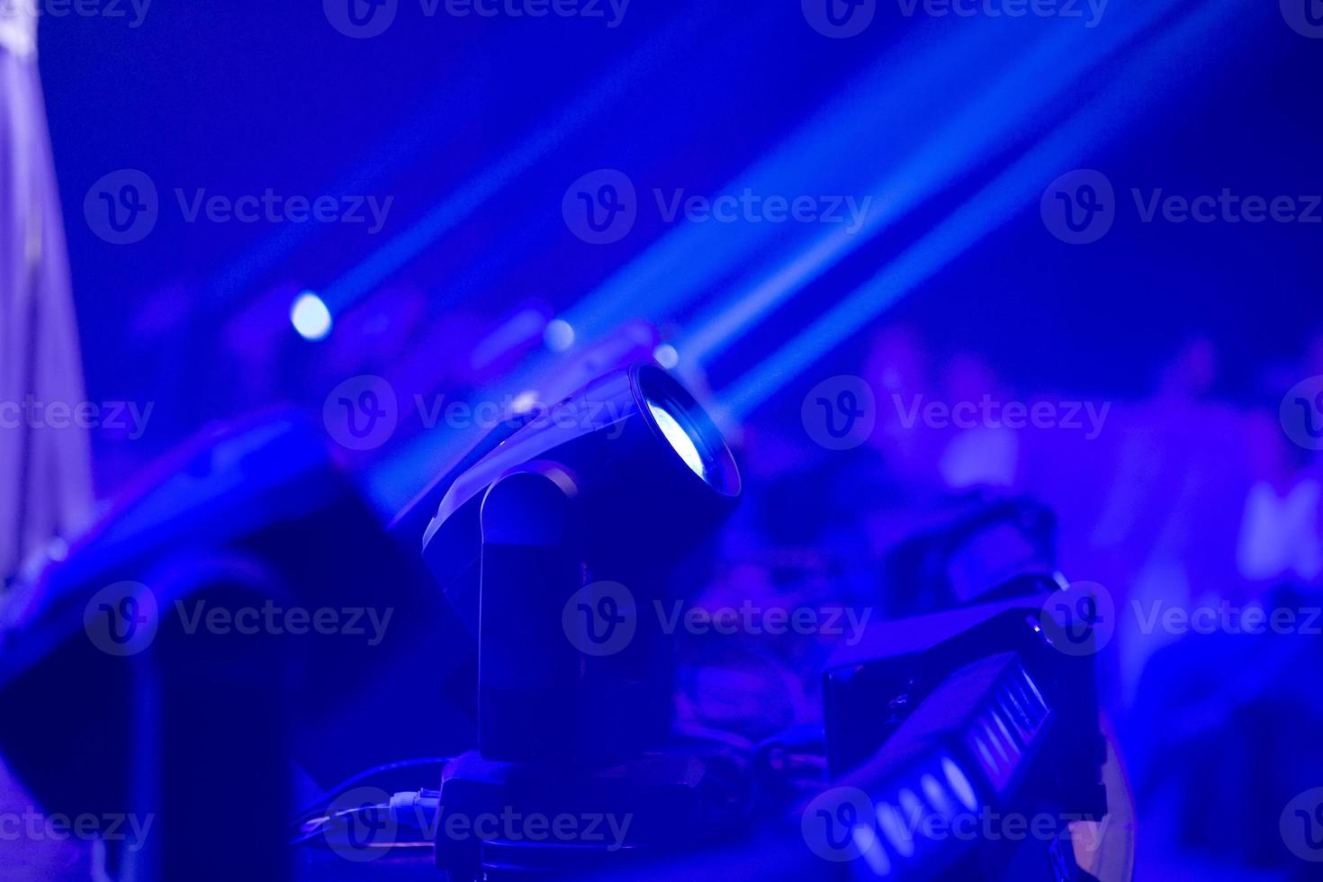 Blue stage background with spotlights lamps. photo