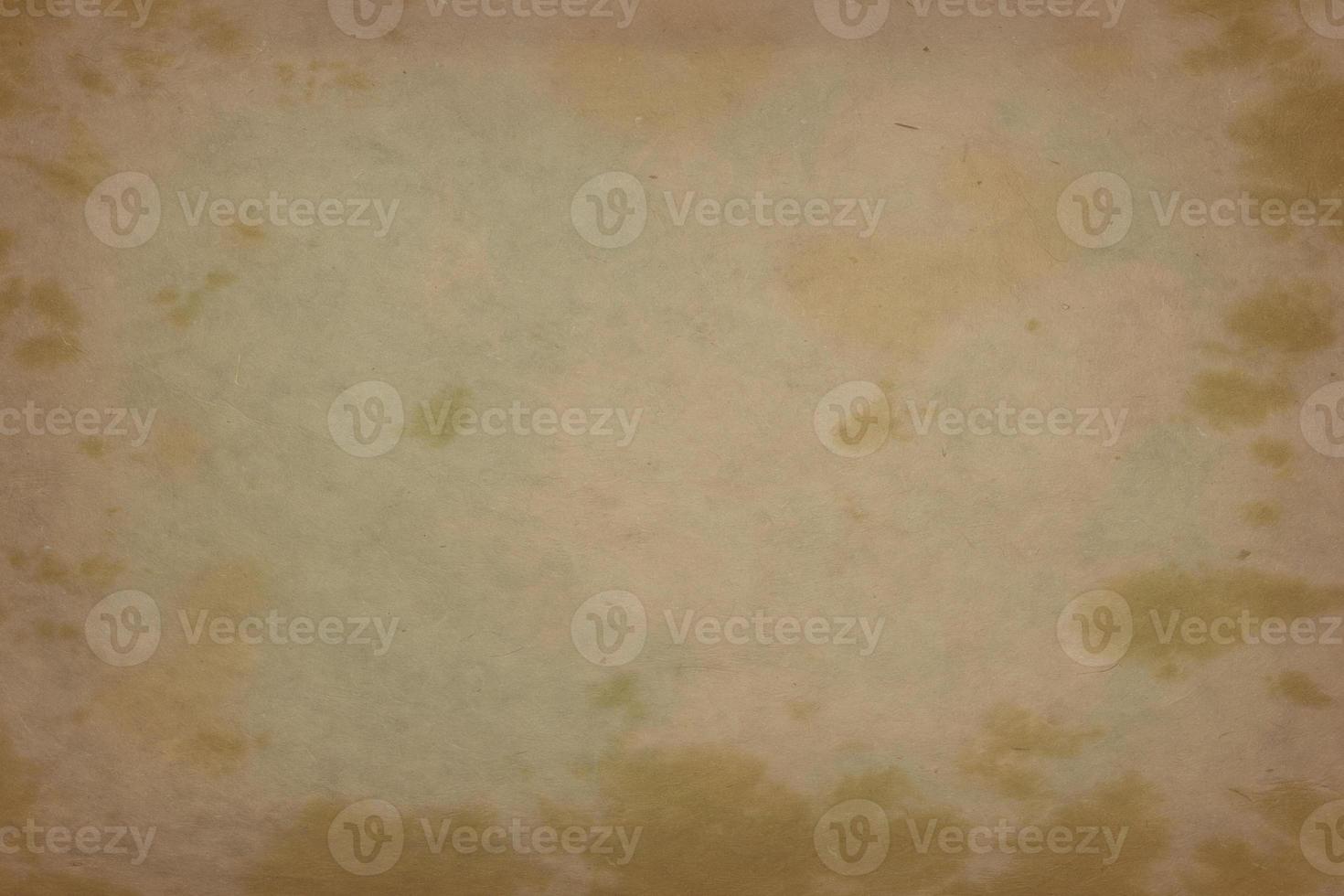 The texture of old oily paper with yellow spots. photo