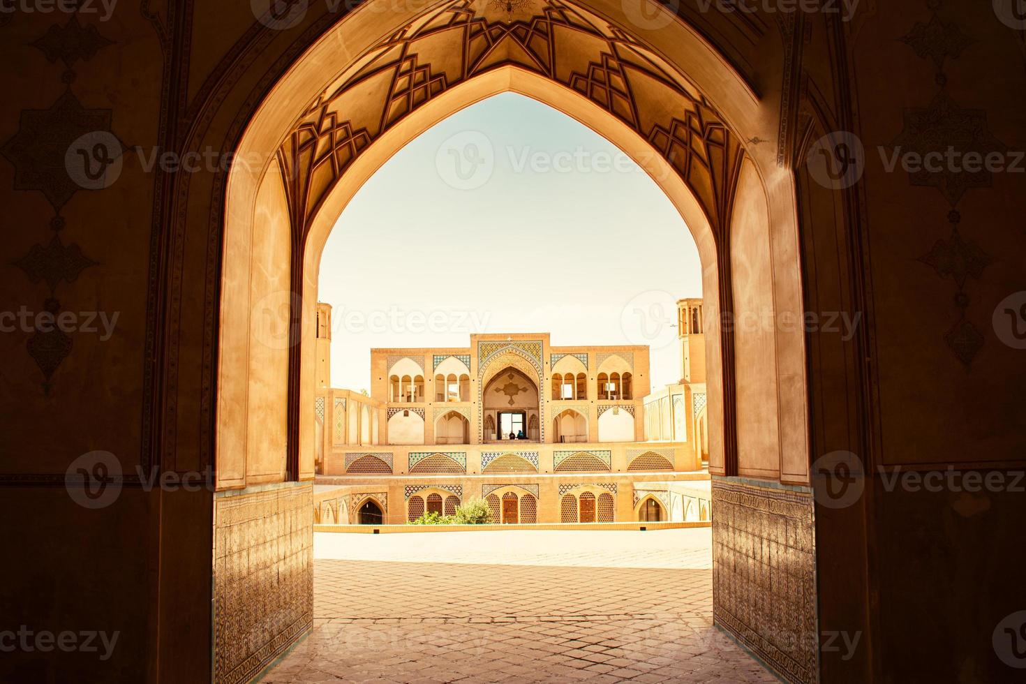 Kashan, Iran,  2022 - Tourists and pilgrims explore sightseeing beautiful Agha Bozorg Mosque photo