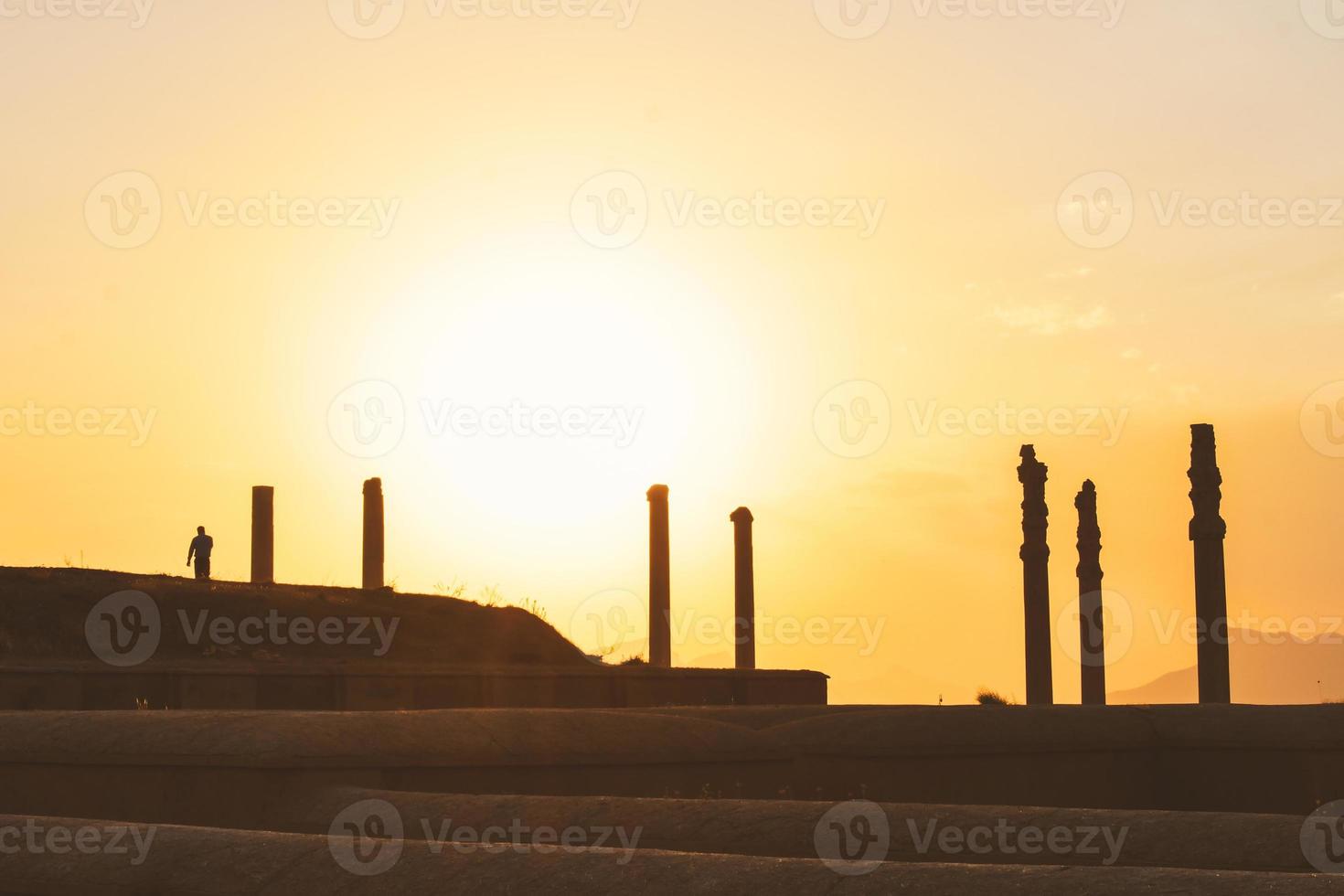 Persepolis, Iran, 2022 - tourist walk by giant column statues - Gates of all nations. Entrance to remains of historical persian city in Persia photo