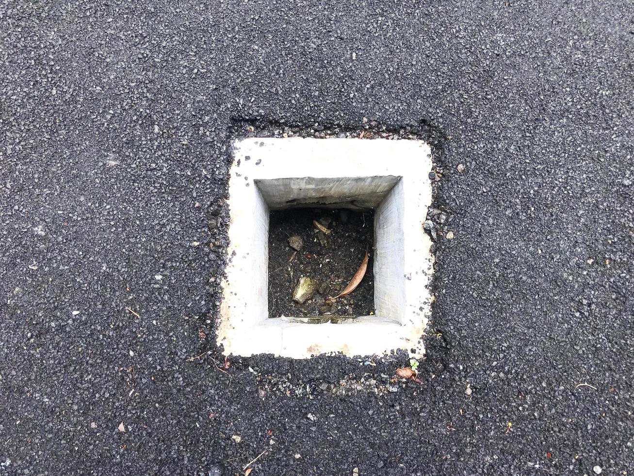 square sewer with black asphalt insulation photo