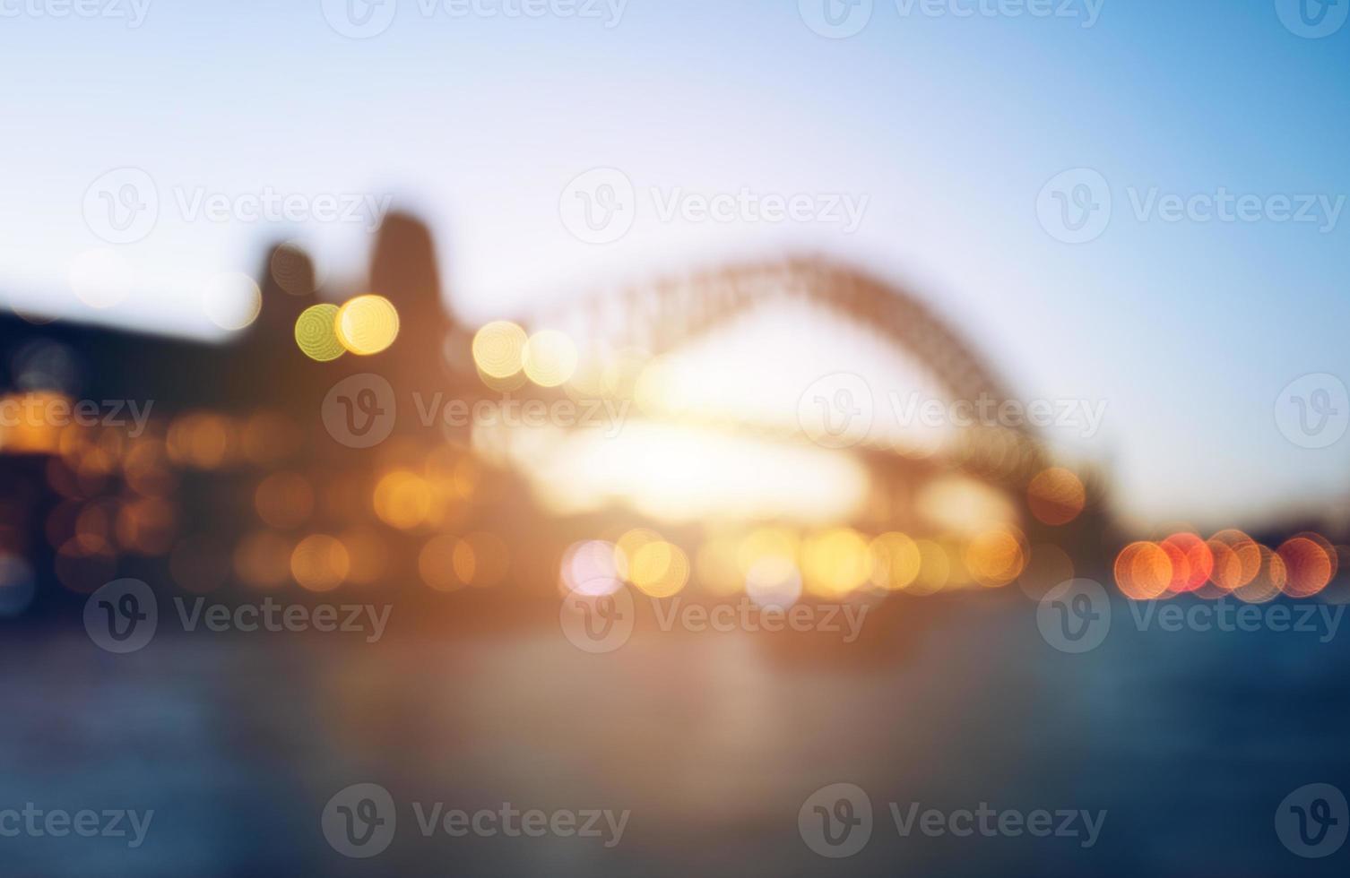 The abstract blurred background of Sydney Harbour bridge during the sunset. photo