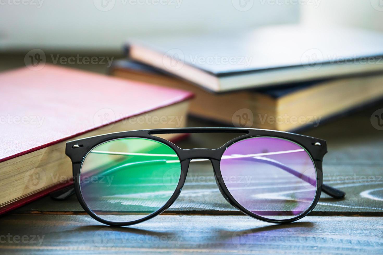 Close up Eye glasses and books photo