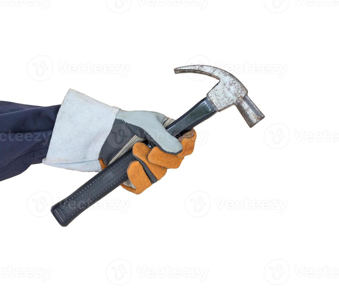 Hand in glove holding hammer on white photo