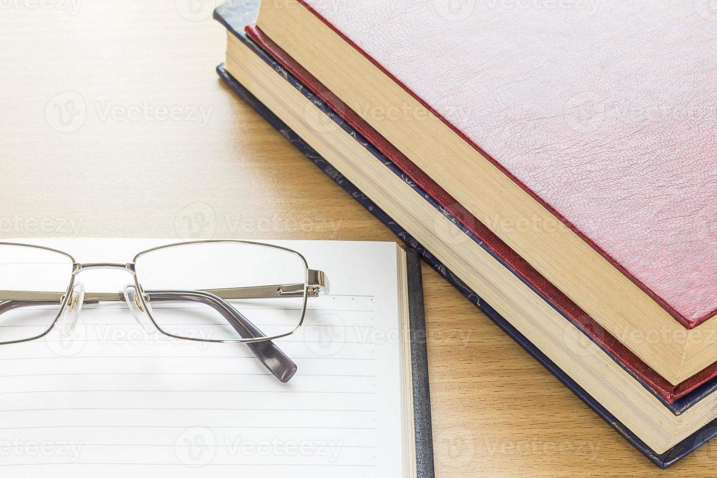Eyeglasses and Notebook open blank page photo