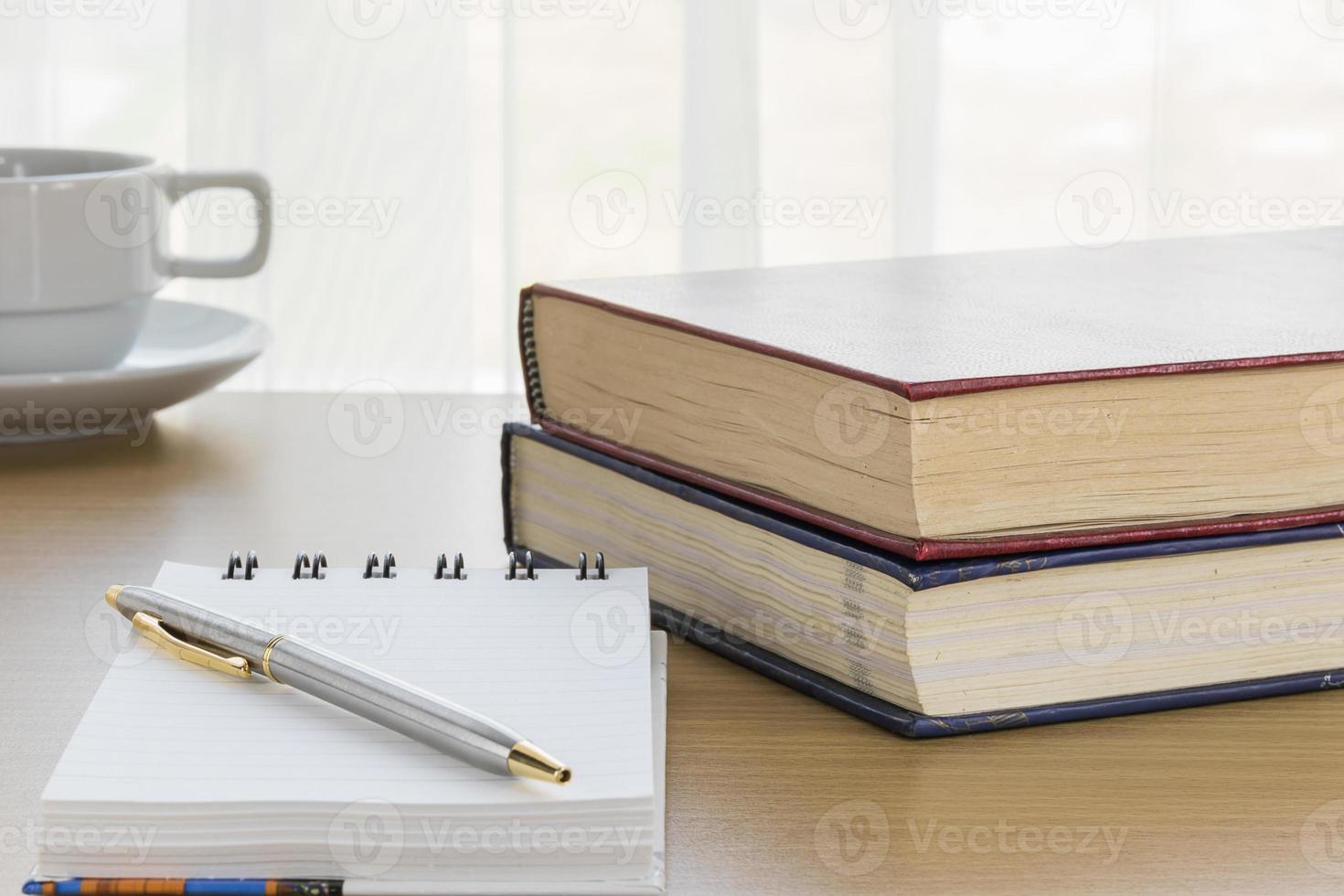 Pen put on notepad open blank page photo