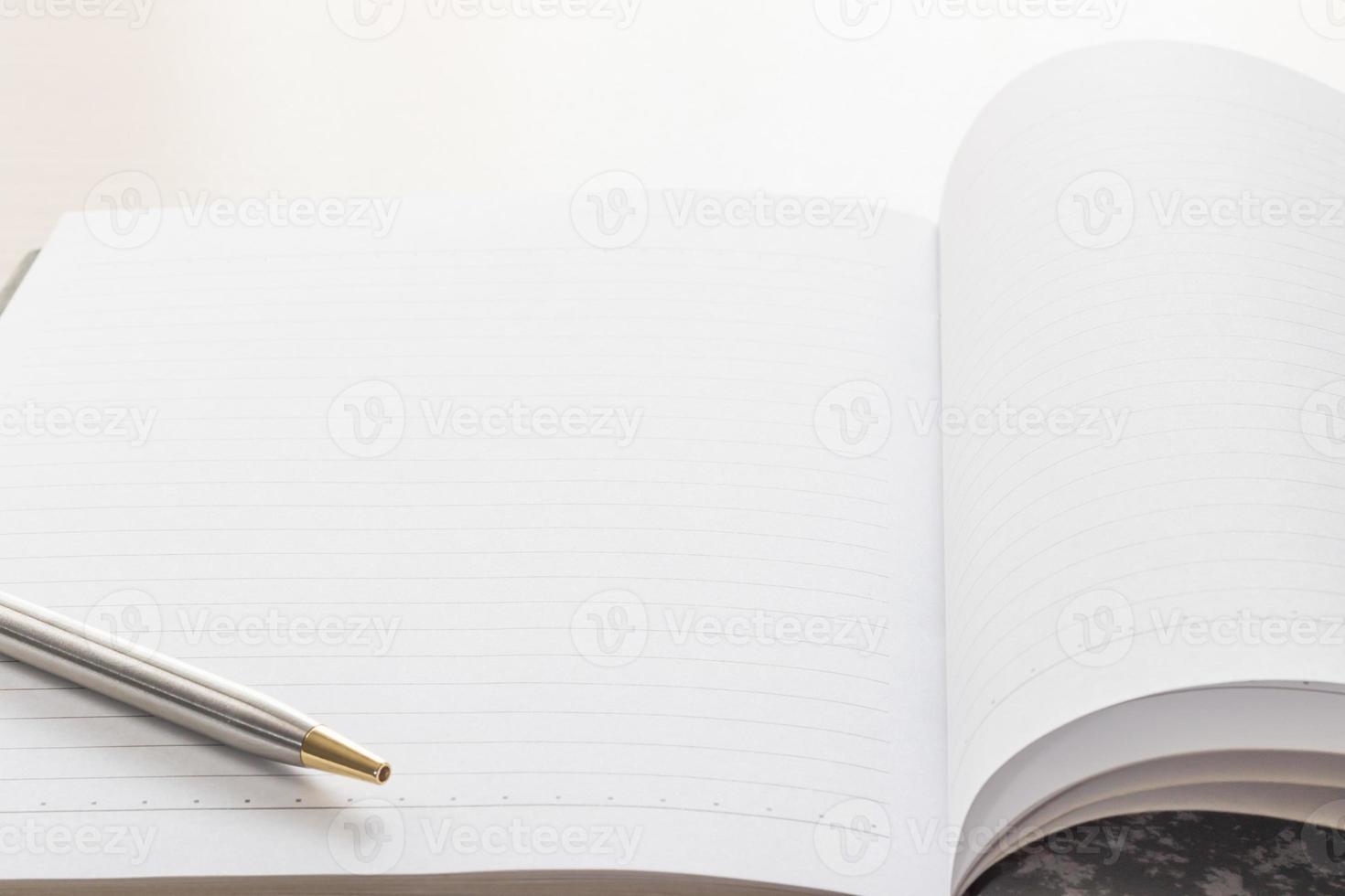 Pen and Notebook open blank page photo