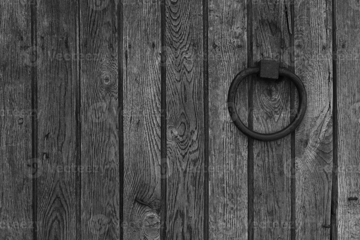 black and white wooden background with metal ring photo