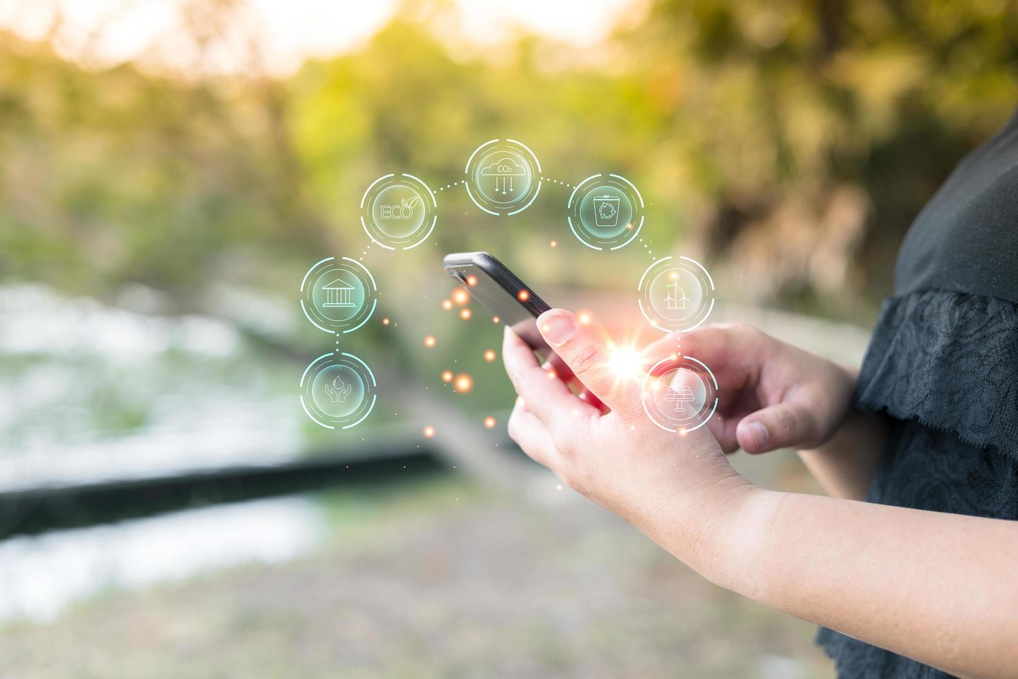 woman use software to save energy, and reduce world warming, and climate change, ecology friendly investment, ESG for Environment Social and Governance. Sustainable business concept. photo