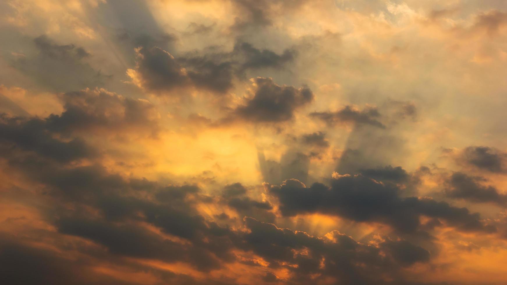 sunset orange beam sky background with white clouds cumulus floating soft focus, copy space. photo