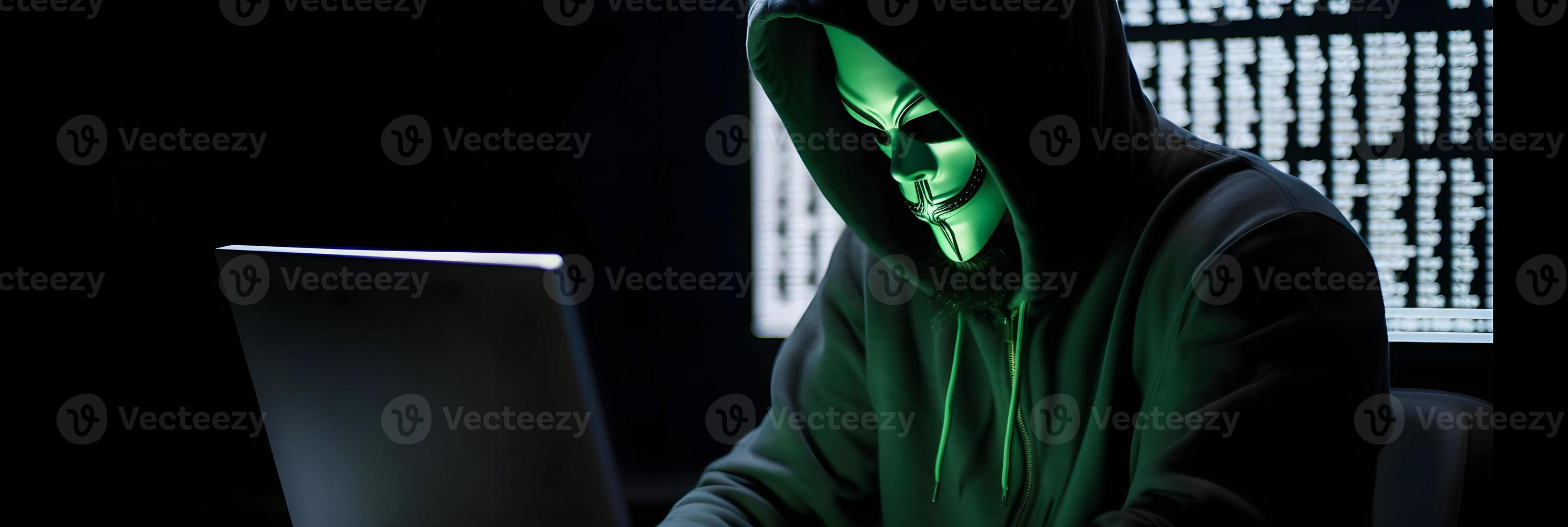 Unveiling the Enigmatic World of Cybercrime. A White Masked Hacker's Front View Amidst Dark Hood and Green Matrix Code Background photo