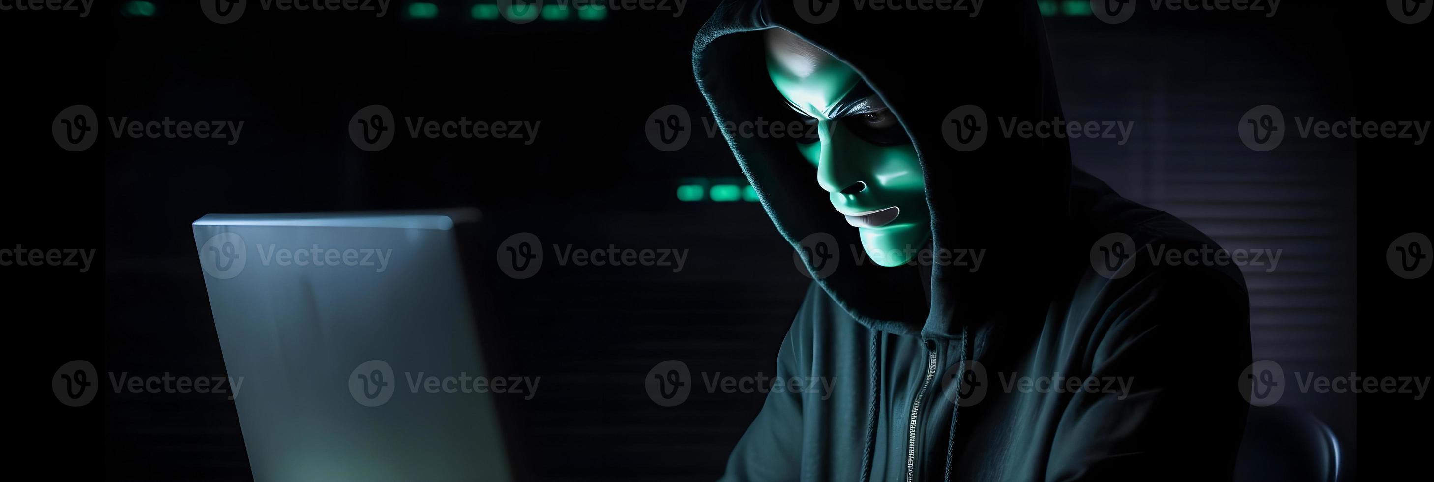 Unveiling the Enigmatic World of Cybercrime. A White Masked Hacker's Front View Amidst Dark Hood and Green Matrix Code Background photo